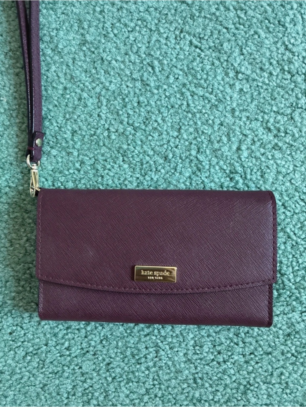 NWOT kate spade plum wristlet clutch with gold plaque. FREE SHIP